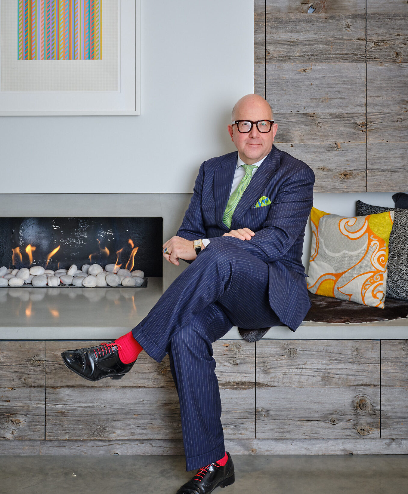 Philip Hoffman the CEO and founder of the Fine Art Group solo shot on a fireplace mantel.